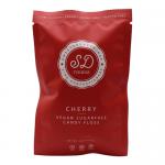 A bright display shows ten individually wrapped 12g candy floss pouches branded SweetDoughThings. Each pouch reveals pale pink cherry-flavored cotton-like strands inside clear plastic, with a red logo and minimalist white label, arranged in a neat clustered row on a neutral background. subtle sheen