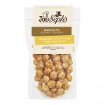 The photo shows a sealed Joe & Seph’s Banoffee Pie popcorn pouch. The glossy cream-and-caramel bag bears the Joe & Seph’s logo, images of popped corn with toffee drizzle, banana slices and a pie illustration, plus the product name and weight.