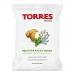 A bright green and cream bag sits upright, showing golden, round crisps scattered beside sprigs of rosemary and oregano. The label shows Mediterranean coastal illustrations, fresh herb graphics, and the brand name across the top.