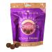 A neatly opened box reveals eight bite-sized round chocolates, their glossy dark-brown shells slightly dusted with cocoa. Each sits in an individual recess. The box art combines cream and chocolate tones with simple logo lettering and a small illustration suggesting a cookie dough centre. Soft sheen