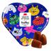 A small decorative tin features retro-style dog and cat illustrations and the Le Chocolat des Français logo. Opening it reveals a neat array of dark chocolate truffles with glossy surfaces that nestle against a contrasting interior lining.