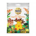 A stack of ten 75g packets of Biona Organic Tutti Frutti Gums sits on a plain background. Each bright packet features the Biona logo, vivid fruit illustrations and a clear window revealing assorted colorful gum pieces, with nutrition text and organic labeling visible. Barcodes and small labels show.