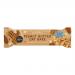 Photo shows a rectangular oat bar in bright wrapper branded Oatopia, with peanut butter imagery and scattered oat flakes. Packaging uses earthy tan and warm orange tones, clear product name typography, and a close-up of textured oat and peanut clusters visible through a window. Soft highlights glow.