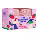 A tray of strawberry meringue nests shows crisp ivory swirls with gently browned tips. Each hollow center holds pale pink strawberry cream and glossy sliced berries, topped with a light dusting of powdered sugar and thin veins of red syrup.