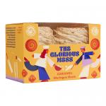 Delicate, swirled meringue nests with crisp pale shells and light golden edges, each filled with glossy amber caramel. Some nests show drizzled caramel ribbons and soft cracks, arranged neatly on parchment in a bakery box.