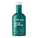 Six 200ml clear glass bottles of Truffle Guys White Truffle Oil sit grouped on a festive surface. Pale golden oil fills each bottle, white labels show the Truffle Guys logo, and seasonal accents—pine sprigs, red ribbon and a gift box—frame the arrangement.