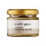 Image shows a festive red box of Truffle Guys Luxury Truffle Slices labeled 40g, six chocolate slices are arranged in a neat row, some unwrapped to reveal glossy, swirled truffle tops. Gold accents, snowflake motifs and holly decorate the packaging against a dark wooden background. subtle shadowing.