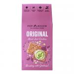 A photo shows a neatly stacked packet of Pep & Lekker Original Mixed Seed Crackers. The 110g bag displays rustic brown packaging with a clear window revealing mixed seeds and crisp cracker edges. A bold logo and seed illustrations appear above small nutritional text. Soft studio light, a few crumbs.