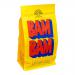 Photo shows a matte coffee bag labeled Lykke Coffee BAM BAM with bold dark logo on a pale beige background, a scattering of roasted beans and a small ceramic cup beside it. Soft natural light highlights textures; wooden table and minimal props frame the composition. Subtle green accents evoke bamboo