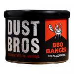 A countertop display presents twelve 65g Dust Bros BBQ Banger packs in a neat grid. Each glossy red-orange pouch features bold black logo lettering, stylized smoke and grill-mark graphics, crisp nutritional panels and clear matte accents, casting soft studio highlights and subtle shadows. and depth.