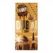 The image shows a box of ten Danny's Dubai Style Caramel Biscuit Crunch bars. Each bar is in a glossy gold-and-brown wrapper bearing the DANNY'S logo and caramel-biscuit artwork. A close-up reveals textured milk chocolate, caramel ribbons and biscuit crunch pieces. Soft lighting and neutral backdrop