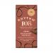 Nine 100g chocolate bars sit neatly in a rectangular carton, each wrapper bearing warm milk-chocolate brown and matte gold accents. Photorealistic hazelnut and truffle illustrations decorate the front, while elegant typography announces Swiss milk chocolate and creamy hazelnut truffle filling. Shiny.