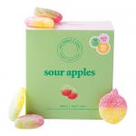 A bright rectangular box displays the Ask Mummy & Daddy Confectionery logo across the top, with vivid green sour apples illustrated spilling from a torn wrapper. Bold green and yellow graphics, a vegan label and 'Pack of 10' text appear against a white background. Glossy highlights and soft shadows.
