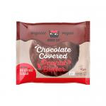 Photo shows twelve 50g Kookie Cat Wild Berry cookie packs with bright magenta and purple wrappers featuring illustrated wild berries and a playful cat logo; a clear window reveals round golden cookies studded with red berry pieces, neatly arranged on a white background. Soft shadows add depth. Glow.