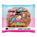 A close-up photo shows a round vanilla cookie studded with glossy, colorful chocolate candies across its surface. Several 50g Kookie Cat Bakery packs with bright, playful branding and a smiling cat logo sit nearby, some slightly overlapping.
