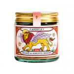 A clear glass jar reveals a coarse, colorful spice mix of orange-red chili flakes, toasted sesame seeds and bright green horopito flecks. An orange label with simple black text wraps the jar; a black shaker lid caps the compact 50g bottle.