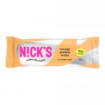 Bright orange wrapper shows the N!Cks logo above a lifelike chocolate-orange wafer illustration. The photo reveals crisp, layered wafers with chocolate coating and flecks of orange zest. The bar rests on a white surface, with soft shadows and a glossy sheen on the packaging. Torn edge reveals layers