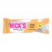 Bright orange wrapper shows the N!Cks logo above a lifelike chocolate-orange wafer illustration. The photo reveals crisp, layered wafers with chocolate coating and flecks of orange zest. The bar rests on a white surface, with soft shadows and a glossy sheen on the packaging. Torn edge reveals layers
