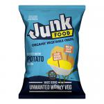 A glossy 100g bag of Junk Organic Potato Crisps Lightly Salted sits upright, displaying a bold logo and simple typography. A photograph of golden, kettle-textured crisps and a halved potato spills across the front, accented by scattered salt crystals on a pale background. Soft shadows fall near bag.
