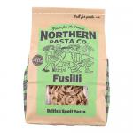 Photo shows eight 450 g packages of Northern Pasta Co. fusilli arranged in two stacks. Transparent windows reveal tight corkscrew pasta spirals. Paper labels display the brand and product name with subtle blue and green accents. Glossy plastic wraps catch studio lighting. Soft shadows edge photo ok.