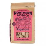 A grocery-shelf photo shows bright yellow Northern Pasta Co. rigatoni packages arranged in a neat row. Clear windows reveal short, ridged tubular pasta. Brand logo and simple graphics sit above nutrition text, while light reflects off the glossy packaging.