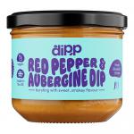 A clear glass jar with a metal lid shows a deep reddish-purple dip inside. The label features bold red and purple graphics with images of red peppers and aubergines and the brand name. A smear of dip and a wooden spoon sit beside the jar on a neutral background.