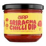 Glossy scarlet chilli dip sits in a clear plastic tub; its smooth surface shows darker red swirls and tiny flecks of chilli. A bright, modern label wraps the side with bold white type and simple graphics. The lid reflects soft overhead light, adding a subtle highlight. A hint of gloss frames the rim.