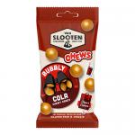 Photo shows a glossy candy pouch with the Van Slooten logo large at the top, warm brown and amber tones, illustrated cola bubbles and fizzy rings, scattered shiny, oval chewy candies at the foreground, clear window revealing treats and playful typography across the wrapper. Glossy sheen catches sun.