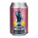 A bright packet of Curry Smugglers Pakora rests on a plain surface, logo and yellow-green design prominent. Several golden, irregular pakora pieces sit beside the packet, their crisp, bubbled surfaces and visible spice flecks catching light, steam rising subtly. A faded map motif sits on the corner.