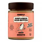 Six clear plastic jars stand in two rows, each labeled with a bright yellow sunflower graphic and bold Sunfly branding. Smooth beige seed butter fills the jars visible through translucent bands. Screw-top lids show matching yellow accents and nutritional panels at the back. On a plain white surface.