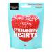 A clear pouch displays bright pink heart-shaped strawberry sweets with a fizzy sugar coating. The Sweet Lounge logo appears on a pink header, and playful fruit illustrations plus vegan and recycling icons border the bag. The pouch has a resealable zip against a white backdrop. Soft shadows frame it.