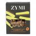 A green-and-white packaged display shows round organic bites studded with flax, sunflower, and pumpkin seeds. The label features the Zymi logo, seed illustrations and weight. Several bites sit loose beside the open pack, revealing a crunchy, seed-dotted surface. soft tones, clear plastic window view