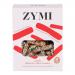 Image shows a compact rectangular packet of Zymi Organic Bites with carob, dotted with black and white sesame seeds. The wrapper uses warm brown and cream tones, displaying a close-up of the seed-speckled bites, a simple logo and minimal natural imagery on a neutral background. Soft lighting reveals