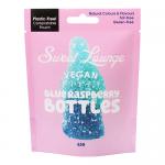 A bright resealable pouch displays the Sweet Lounge logo and vivid blue-raspberry artwork. The front shows numerous fizzy bottle-shaped gummies in electric blue, which are dusted with sparkling sugar crystals. Clean typography and vegan icons appear on the glossy packaging.