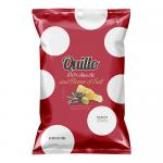 The photo shows a Quillo Fleur de Sel potato chips bag standing upright against a plain background. The light-colored pack features blue accents and crisp golden chips spilling from an open top, with visible texture and salt flakes.
