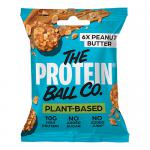 A small resealable brown pouch sits against a white background. The label shows bold brand text and product name, with green and white accents and small icons for vegan and vitamins. A clear window reveals round peanut-brown protein balls, with a few balls scattered beside the bag. Close up details.