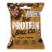 A matte resealable pouch displays The Protein Ball Co logo above a photograph of round coffee-colored oat muffin protein balls scattered beside a coffee bean and oats. Earthy brown and cream tones, a clear product window, and simple icons and text appear on the front.
