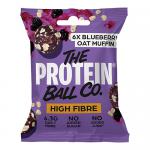A vibrant bag displays The Protein Ball Co logo above an illustrated blueberry oat muffin, with scattered blueberries and oat flakes. Ten small round vitamin balls sit in front on a white surface. The design uses blue and purple hues and clean typography.