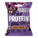 A vibrant bag displays The Protein Ball Co logo above an illustrated blueberry oat muffin, with scattered blueberries and oat flakes. Ten small round vitamin balls sit in front on a white surface. The design uses blue and purple hues and clean typography.