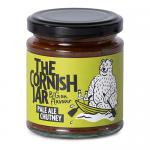A cluster of six small glass jars holds amber-brown pale ale chutney. Each jar has a metal screw lid and a cream label featuring The Cornish Jar logo and bold product name, simple decorative accents and clear glass that reveals the textured chutney inside.