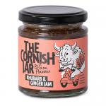 Six glass jars of rhubarb and ginger jam sit clustered on a wooden surface. The jam shows a translucent rosy-red hue with visible ginger flecks. Each jar bears a cream-colored lid and a vintage-style label reading The Cornish Jar, evoking a rustic, artisanal look. Soft light reveals glossy texture...
