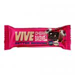 Photo shows a small chocolate brownie in a clear wrapper inside a branded box. The brownie is dense, dark chocolate with a glossy cherry glaze and a halved glacé cherry on top. Packaging features the Vive Bakery logo and a red-accented Cherry Bakewell label.