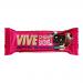Photo shows a small chocolate brownie in a clear wrapper inside a branded box. The brownie is dense, dark chocolate with a glossy cherry glaze and a halved glacé cherry on top. Packaging features the Vive Bakery logo and a red-accented Cherry Bakewell label.