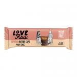 Photo shows twelve LoveRaw Almond Butter Cups in bright individual wrappers, arranged in a neat grid with one unwrapped cup revealing a creamy almond filling and glossy chocolate coating. Packaging uses earthy browns and soft pastel accents with clear logo and product name. On pale neutral backdrops.