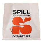 A rectangular cardboard box of Spill Tea Everyday sits upright, displaying warm yellow and green packaging and the brand logo. Six individually wrapped teabags peek from an open flap. A steaming teacup illustration and loose leaf motifs decorate the front against a clean white background. Soft halo.