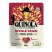 A bright upright packet of Quinola Wholegrain quinoa sits against a neutral background. The beige and green packaging shows a clear product window revealing pale ivory grains. Bold brand lettering tops nutritional icons and simple vegetable illustrations at the base. A small wooden scoop lies nearby.