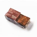 A tray of twelve dark chocolate brownies sits neatly in a bakery tray, each square showing a glossy, crackled top and slightly raised edges. The interior appears fudgy and dense, with a deep brown color and scattered chocolate shards and dusted cocoa on the surface. Tiny air pockets catch the light.