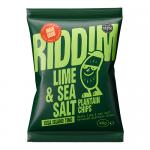 A bright Riddim Snacks bag shows the brand name and lime and sea salt in bold, a lime wedge with scattered salt crystals, a photo of golden plantain chips spilling out, tropical leaves and glossy, colorful packaging.