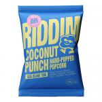 Vibrant Riddim Snacks Coconut Punch popcorn packaging features turquoise and coral gradients, a bold white logo and playful palm-leaf and coconut illustrations. A clear window reveals glossy, lightly-coated popped kernels; individual 35g bags are shown neatly aligned in a 30-count box. Shiny finish.