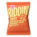 Image shows a compact display of thirty bright snack pouches, each labeled Riddim Snacks Sweet Biscuit Popcorn. Glossy yellow-and-orange bags sit in a neat grid, with overflowing popcorn kernels and biscuit pieces visible through a small transparent window on each pack. A bold logo crowns the top.!!